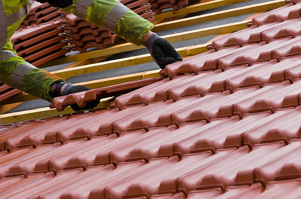 Houston roofing experts installing energy-efficient roofing materials