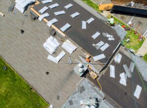 A roof replacement in progress, prompting the question, "Should I stay home during roof replacement?"