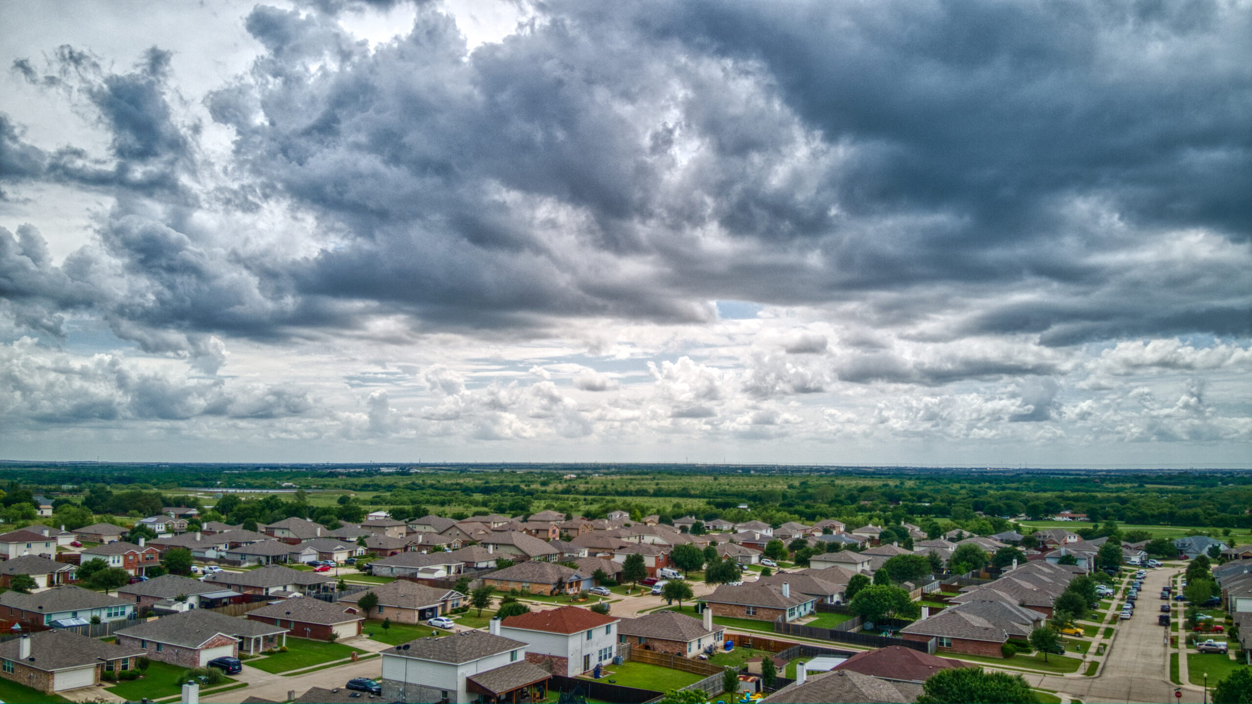 A neighborhood of homes with roofs installed by the best roofing companies in the Houston area