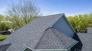 A new asphalt roof shown as a common roof type when asking "How long does a roof last?"