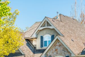 An asphalt shingle roof seen in a blog answering "How many layers of shingles should be on a roof​?"